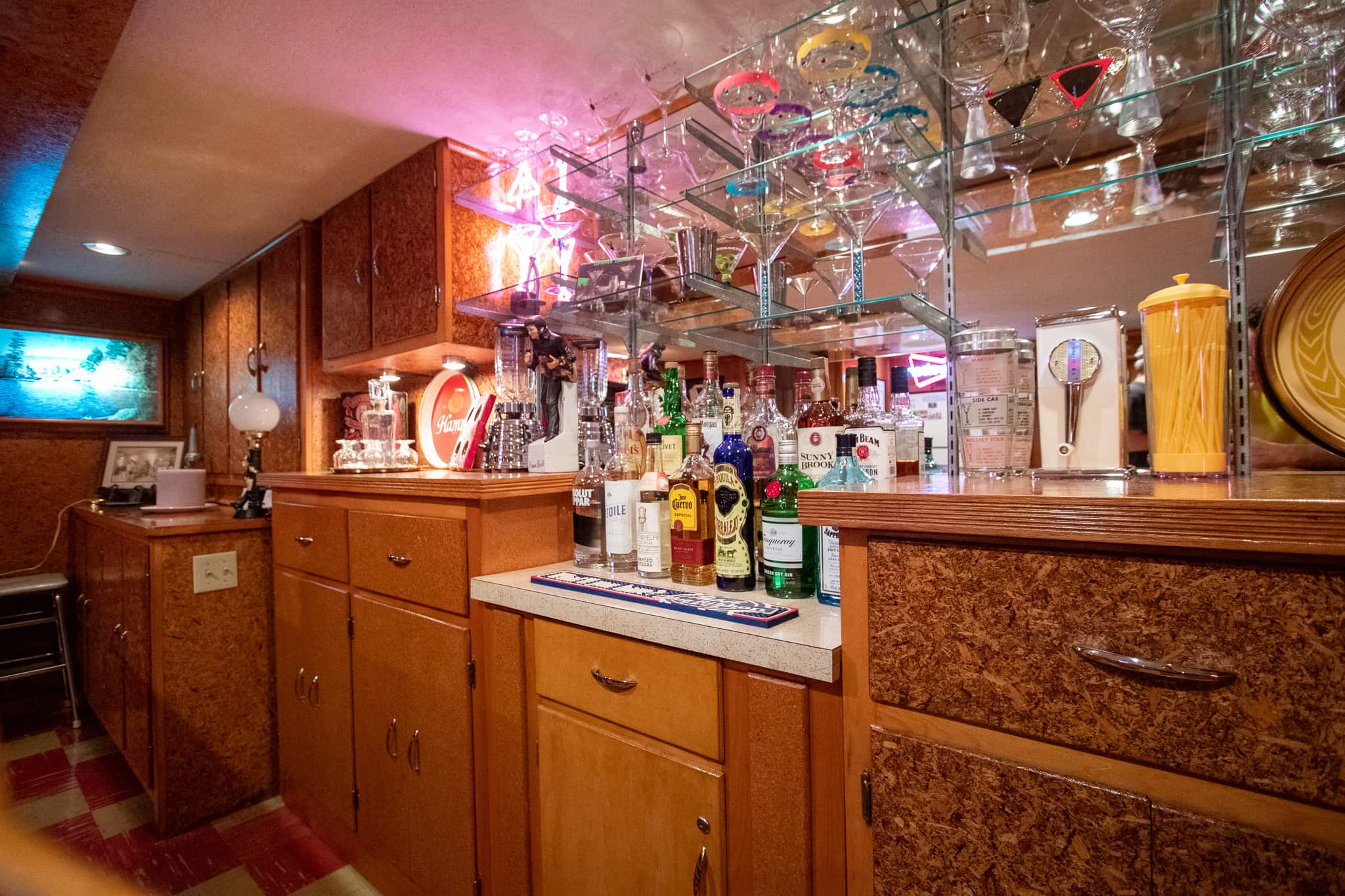 Vic and Nancy enhanced the bar by adding the mirrors and glass shelves.