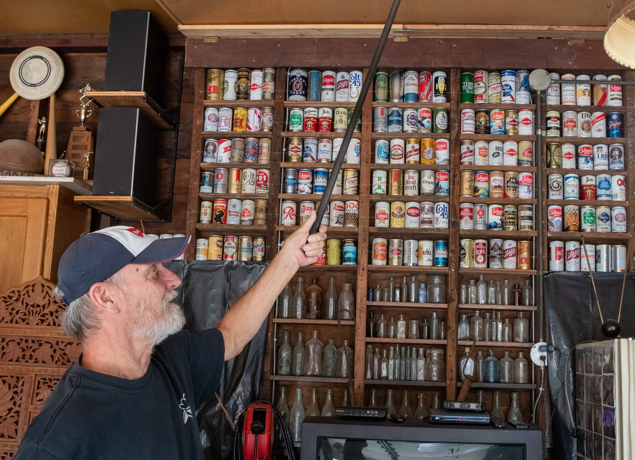 The beer cans, hidden behind Hamm’s Beer displays, entered Vic’s collection when he worked for a Mankato beer distributor.