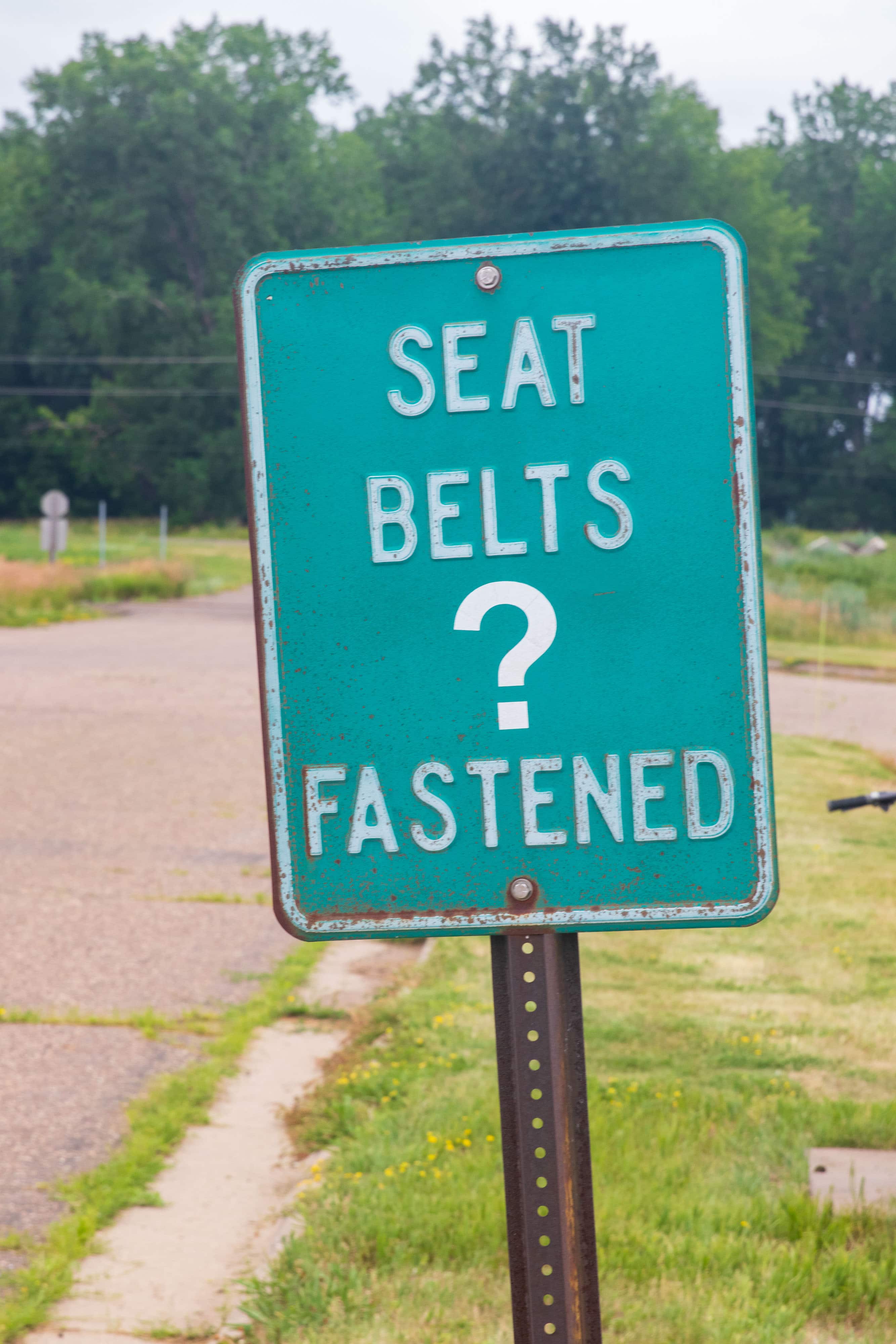 Sign reads "Seat Belts Fastened?"