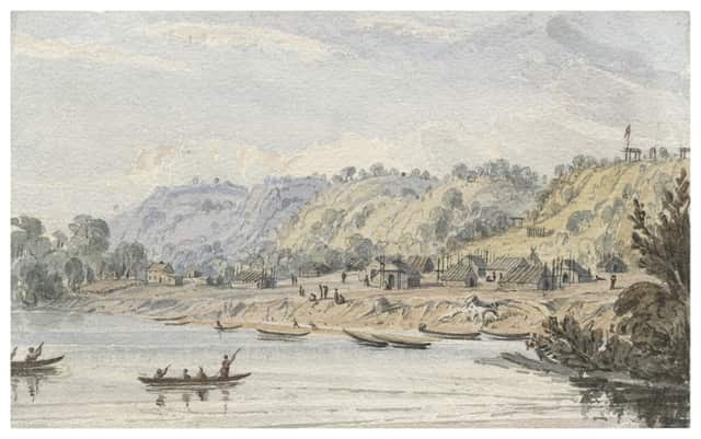 Kaposia by Seth Eastman. Canoes dock at a village, located on a river flat beneath the tree-covered bluffs above.